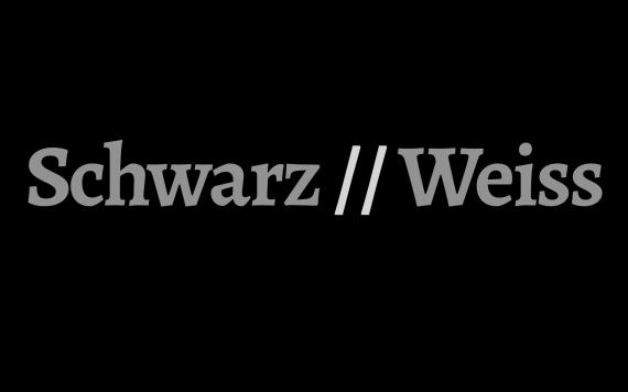 Die Schrift Schwarz//Weiss in grauer auf schwarzem Grund